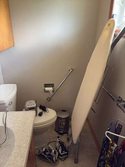 Ironing board, 2 steam irons, ss waste basket, radio and hair clippers