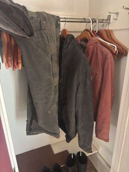 Carhartt size medium Coats overalls and two pair of muck boots men’s seven and eight - these items do come from a smoking home