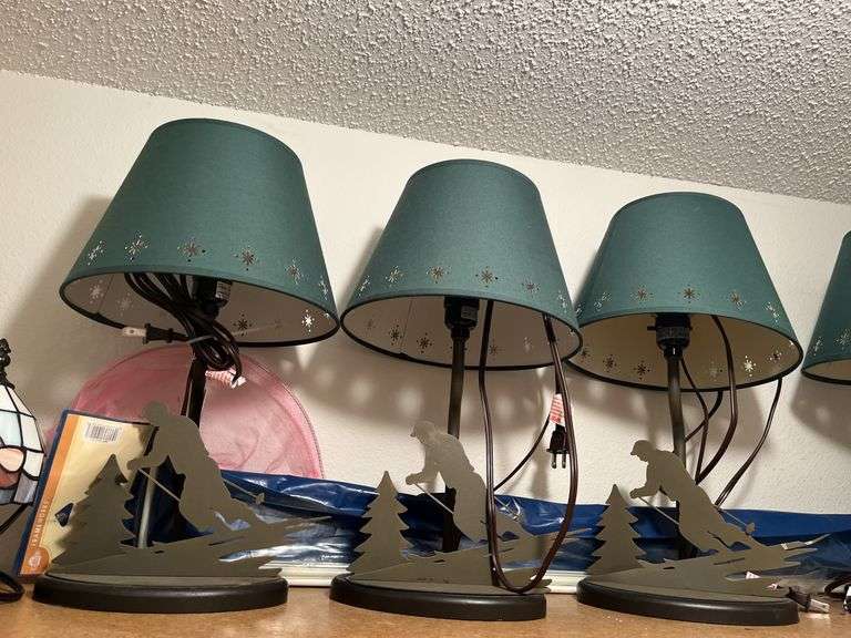 Five table lamps with winter themed base and three others