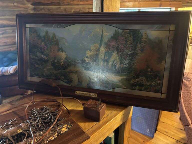 Treasures on top of bookshelf, Lighted Thomas Kincade print, lamp, decor items,