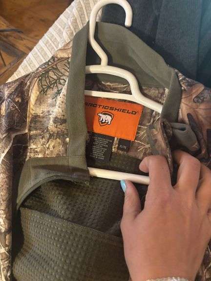 large assortment of camo and hunting clothing mostly XL