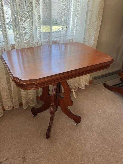 Antique walnut parlor table with original porcelain casters 20 x 31