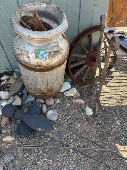 Garden art including milk can