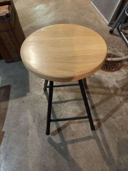 Three round folding stools and two folding chairs