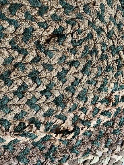 63x52 braided rug, see photos for condition Couple small holes