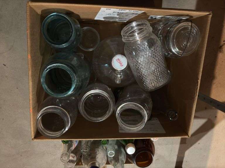 Various glass bottles and jars includes blue glass, Coca-Cola 1 gallon bottle, old soda bottles, etc