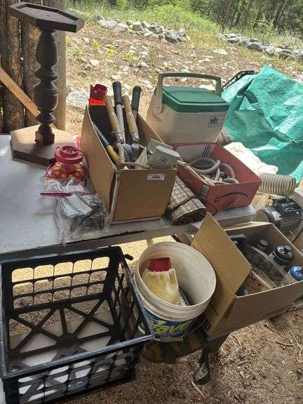 Misc treasures - hummingbird feeder, garden tools, rope, cooler, small propane tanks