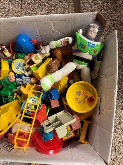 Box of assorted Fisher Price people and animals along with a bunch of other small toy items
