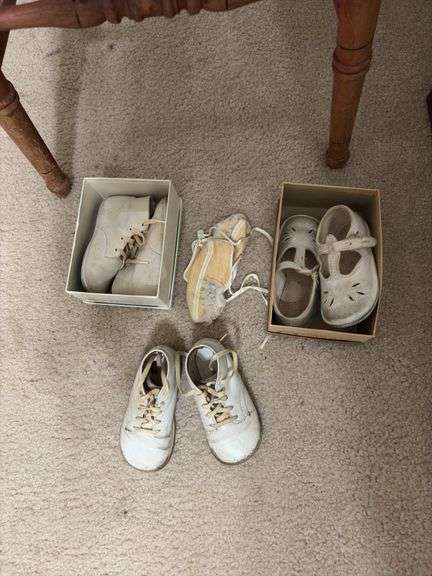 Antique wooden high chair and baby shoes Per Seller dates back to 1877