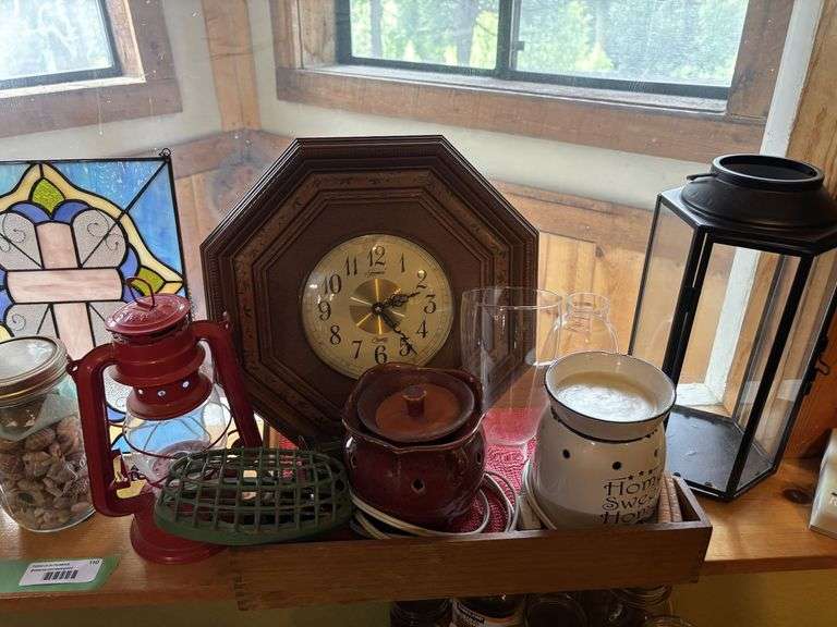 Decorative rocks and shells, stained glass, clock, candles and candle warmers