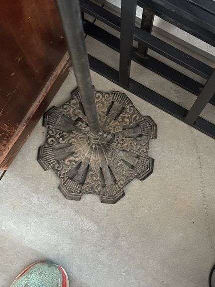 Antique cast-iron birdcage holder with vintage wooden cage