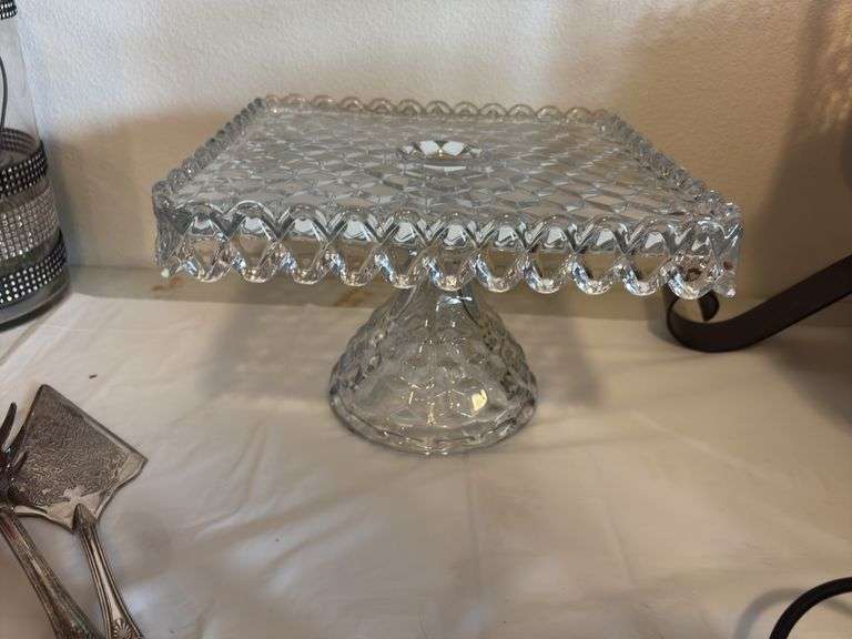 American Fostoria square cake stand, weighted sterling candlesticks, cake server and spaghetti spoon