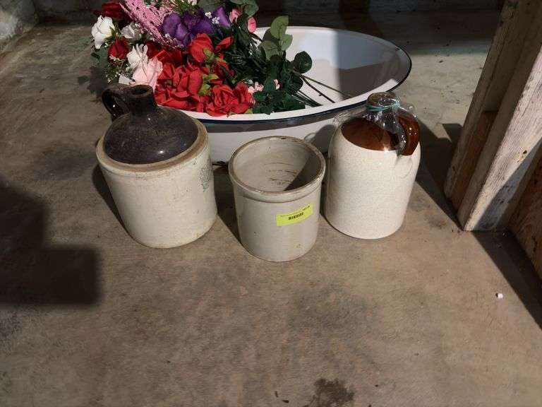Large enamel tub with artificial flowers, two brown top jugs and a small crock