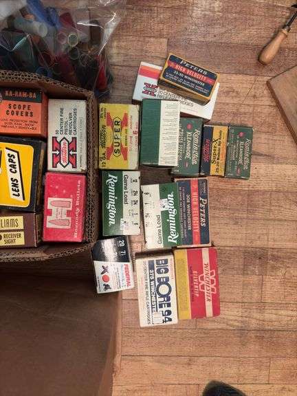 Grocery sack and box full of old cartridge boxes, most empty, some have hulls. Good man cave decor