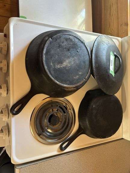 Two cast iron skillets - one lid, one wagner