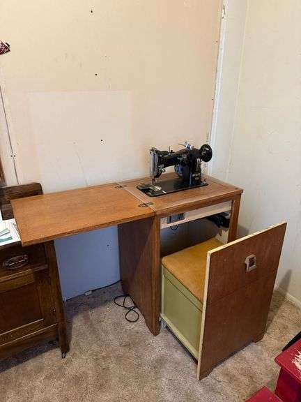 Singer sewing machine with fold out table and chair