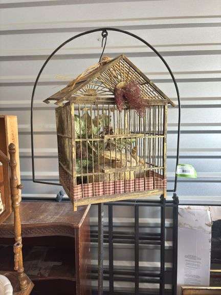 Antique cast-iron birdcage holder with vintage wooden cage