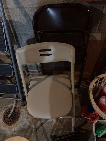 Three round folding stools and two folding chairs