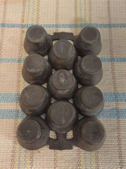 Cast iron cornbread pan marked 7 S E and muffin pan