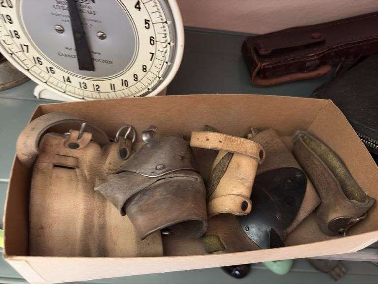 Hansen Model 2000 utility scale, two small sad irons, butter pat mold, Manson Tape tin, husking pegs