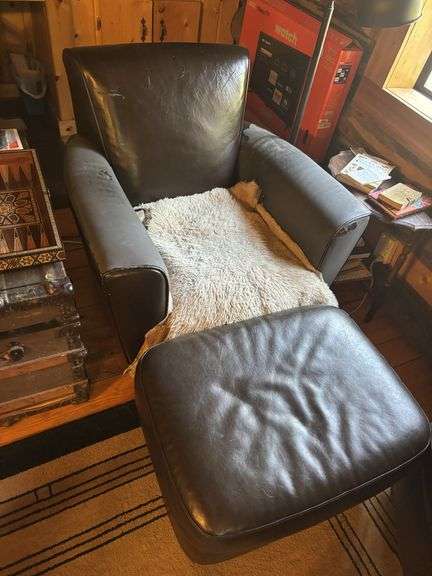 Pair of arm chairs with ottomans - both have large wear spots