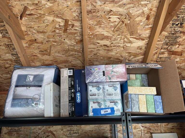 Lots of boxes of new tissue, OralB set of two electric toothbrushes, LED flush mount light, queen size mattress pad