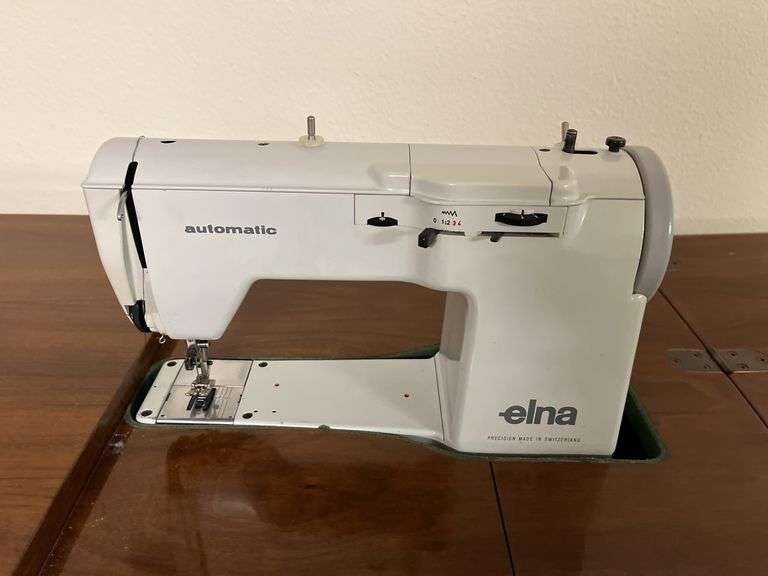 Elna sewing machine in walnut stand 18D x 36L x 31H