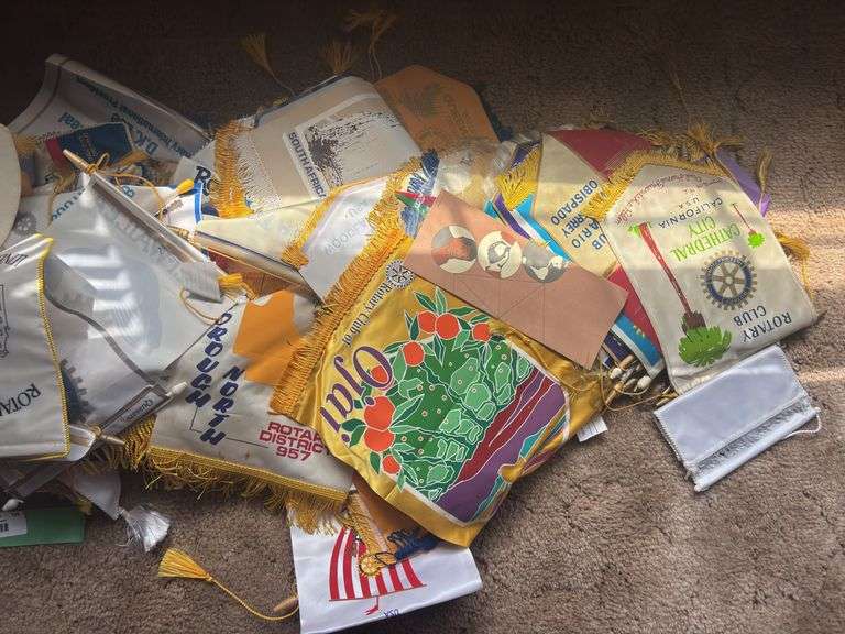 Large assortment of rotary club flags from all over the world! These have been in a smoking home