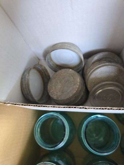 Box of blue canning jars of various sizes