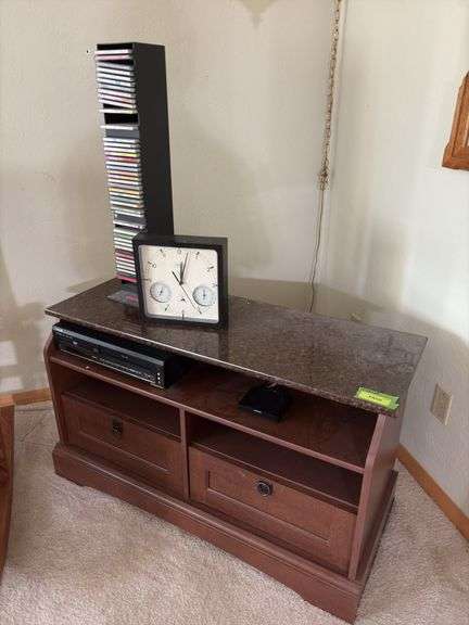 TV stand 19D x 42L x 24H, VHS/DVD player, tapes, CDs, clock/thermometer/humidistat