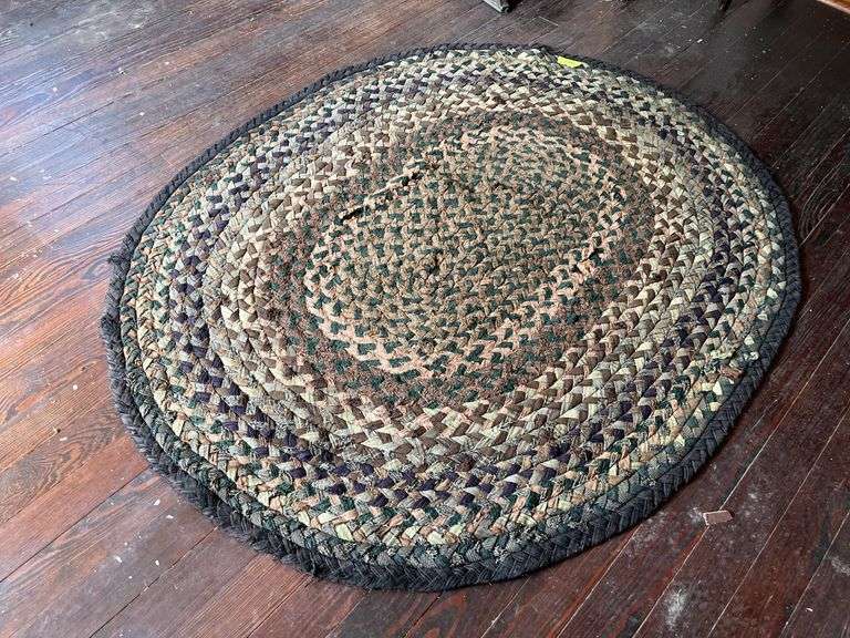 63x52 braided rug, see photos for condition Couple small holes