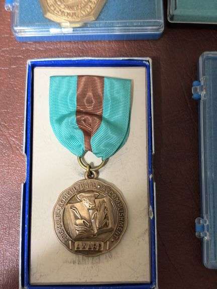 DeKalb, IA high school music association and Hoover trail medallions
