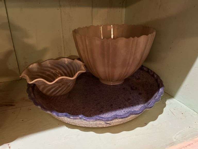 Contents of cupboard include vases, coffee mugs, TV lamp, etc