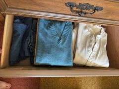 Contents of dresser includes men’s thermals size L, women’s flannel shirts size M, sweaters, heavy undershirts, jeans Clothing is all sizes