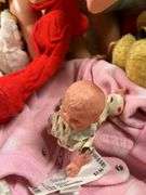 Old and older dolls, bassinet and stand