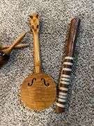 Rain stick, mini banjo, harmonica and maracas