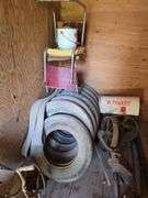 Grapple hay forks, old car tires (3pr), steel wheel, hand crank sheep shear head, old steel baby crib, primitive homemade stilts