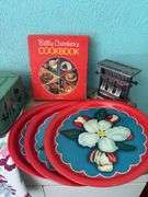 Vintage kitchen items includes Betty Crocker cookbook, serving trays, toaster and cake server