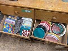 Eight drawer dresser, full of gift wrapping and party items plus large quantity of wrapping paper