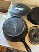 Two cast iron skillets - one lid, one wagner