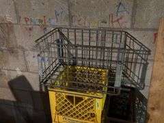 Plastic dairy crates and one wire carrier