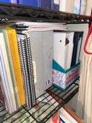 Metal shelf unit, education materials all in closet