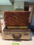 Vintage suitcase, picnic basket and wooden Coast to Coast level