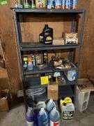 Contents of metal shelf and above stairs includes motor oil, deicers, washer fluid, extension cords, glues, etc