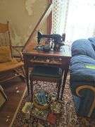 Singer elec sewing machine in stand and sewing notions