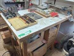 Large router table includes router and lots of router bits - try to come at the end - may need disassembled to remove
