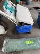 Coleman rolling cooler, lawn chair and a canopy so you can sit in the shade while you drink alone.