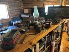 Treasures on top of bookshelf, Lighted Thomas Kincade print, lamp, decor items,
