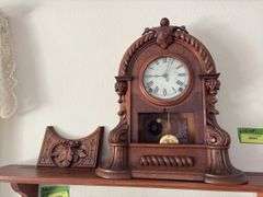 Antique walnut key wind shelf clock, very ornate carved case. Not sure if American or European ???