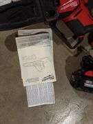Milwaukee Fuel M18 pruning saw with battery and charger